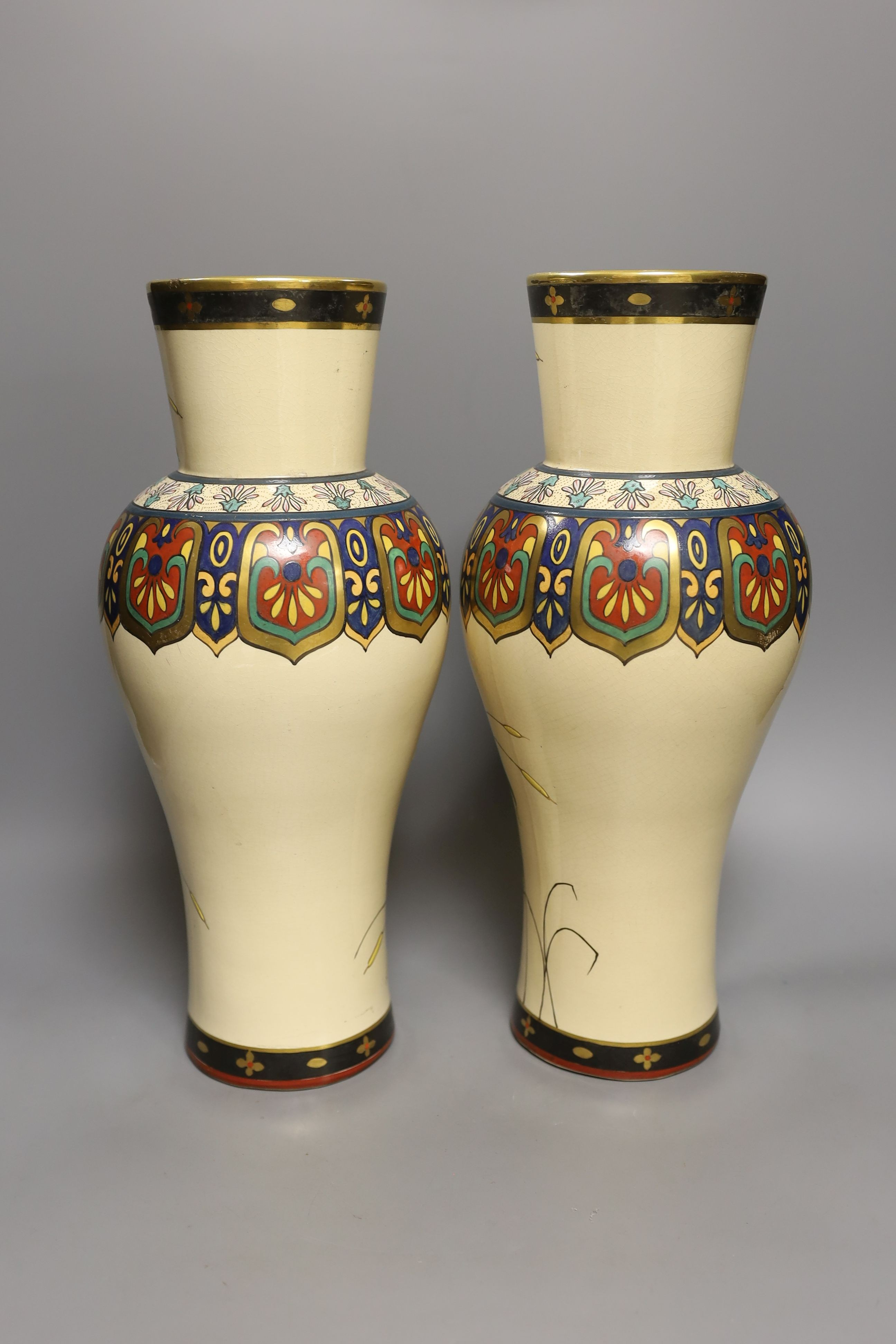 A large pair of Japonaise phoenix decorated baluster vases, 38 cms high.